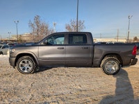 The 2026 Ram 1500 Big Horn Crew Cab in Granite Crystal Metallic combines rugged capability with refi... (image 2)