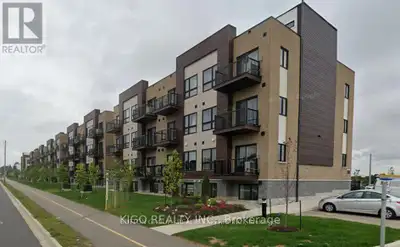 No stairs! Modern 2-bedroom, 2-bathroom stacked townhouse with a private balcony and one parking spo...