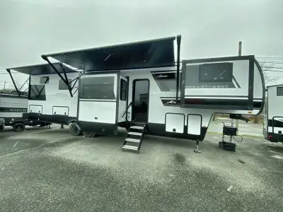 EAST TO WEST Ahara fifth wheel 380FL highlights: Rear Master Bath Kitchen Island with Extensions 24i...