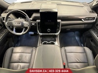 The 2025 GMC Yukon XL Elevation 4WD commands attention with extended-length presence, bold monochrom... (image 9)