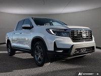 This Honda Ridgeline boasts a Regular Unleaded V-6 3.5 L/212 engine powering this Automatic transmis... (image 7)