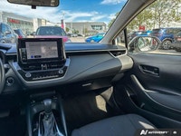 This 2023 Toyota Corolla Hybrid LE sedan offers impressive fuel efficiency and a surprisingly spacio... (image 9)