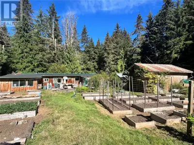 Remarkable 11.35-acre property, nestled in lush forested neighborhood. This South facing lot feature...
