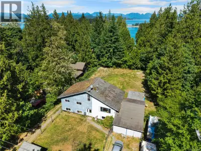 Opportunity awaits on this 0.46-acre property just a stone's throw from Rebecca Spit. Offering a 4-b...