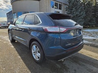 This 2016 Ford Edge SEL finished in Blue with a Black interior pairs a peppy EcoBoost 2.0L Turbo I4... (image 4)