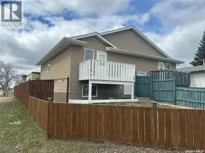 Seize this exceptional investment or family-living opportunity! This spacious 1/2 duplex bi-level of...