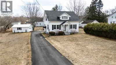 Welcome to this charming storey and a half residence nestled on a picturesque lot framed by mature t...
