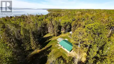 PRIVACY & AFFORDABILITY fronting on park lands with direct water & beach access - Located central ea...
