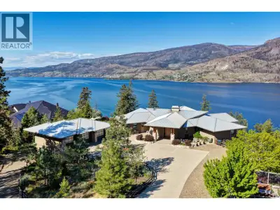 Set on 6.7 lakeshore acres above the shimmering waters of Okanagan Lake, this peaceful and private w...