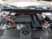 The 2026 Honda CR-V Hybrid Touring AWD in a stunning White finish is revolutionizing the SUV experie... (image 5)