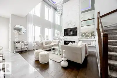 Stunning 2020-built Beaumont home with soaring two-storey windows, central A/C, main floor office an...