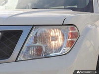 Ready for any adventure or workday, this 2018 Nissan Frontier Crew Cab Pickup in striking Glacier Wh... (image 5)