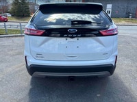 Command every journey in this pristine white 2024 Ford Edge SEL, boasting a sophisticated All-Wheel... (image 2)