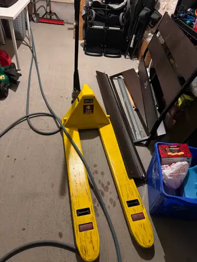 Heavy-duty pallet jack with a 5,500 lb capacity, perfect for warehouses, workshops, garages, moving...