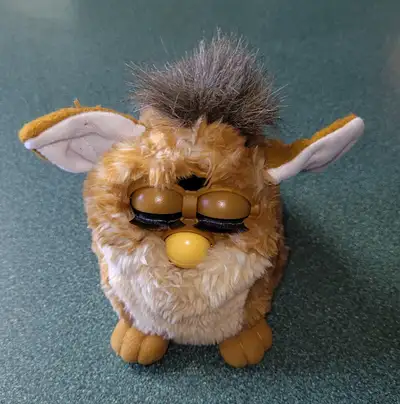1998 Furby. Need repair $30.00 1978 lesney Jimmycricket diecast $25.00 1980s Feels so real doll $80....