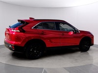 The 2026 Mitsubishi Eclipse Cross NOIR S-AWC, clad in a striking red exterior, combines the robust h... (image 5)