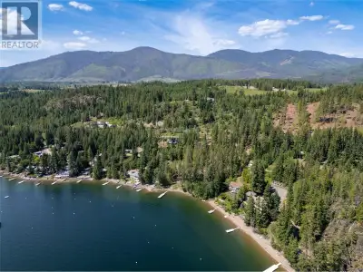WATERFRONT ACREAGE on the shores of the sunny Shuswap! This exceptionally well-appointed estate prop...