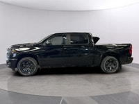 The 2026 Ram 1500 Big Horn 4x4 Crew Cab 57 Box comes in a striking Diamond Black Crystal Pearl finis... (image 1)