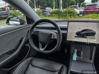 This Tesla Model 3 delivers a Electric engine powering this Automatic transmission. Window Grid Ante... (image 8)