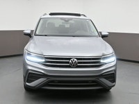 Itâ€™s hard to stand out in a crowd, but the 2024 Volkswagen Tiguan strives to escape the genericism... (image 1)