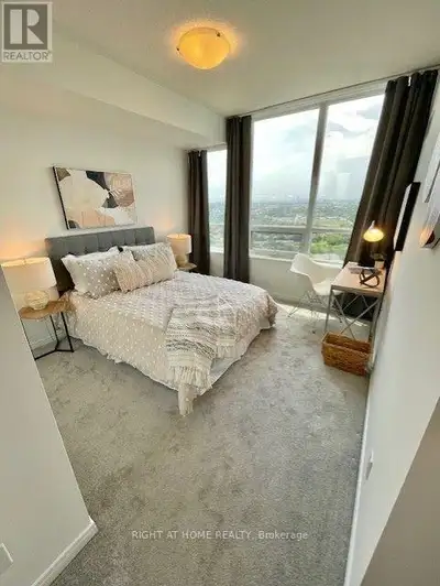 Wake up to breathtaking panoramic views from the expansive wrap-around balcony, where the Toronto sk...