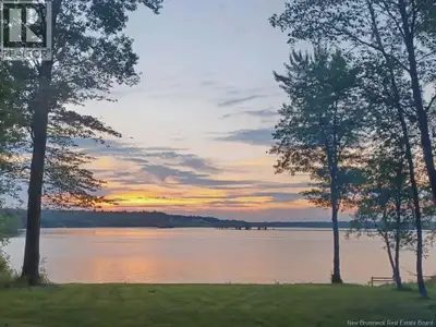 Set along 324 feet of waterfront on beautiful Washademoak Lake, this 2.4-acre property offers privac...