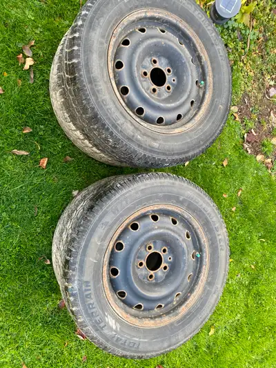 Four 16 inch 215 /70 r 16 winter tires on rims Tread is low but rims are in good shape