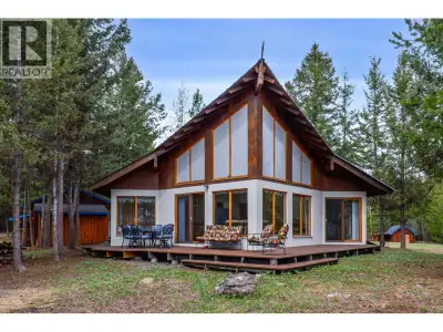 Set on over 10 private, pristine acres, this inviting property offers a peaceful peekaboo view of Br...
