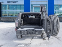 The 2024 GMC HUMMER EV SUV 2X commands attention with an electrified, wide-body stance that blends b... (image 8)