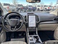 Experience effortless journeys in this sleek Black 2021 Ford Edge Titanium AWD. With just 40,149 kil... (image 9)