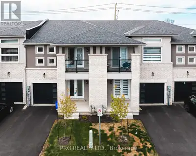 Welcome to the contemporary elegance nearly-new, one-year-old townhouse located in the thriving hear...