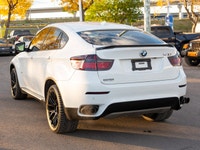 2010 BMW X6 50i with winter tires, Armed Street rims, brown leather interior, heated seats, heated s... (image 9)