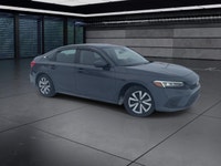 The 2024 Honda Civic Sedan LX-B CVT in sophisticated gray combines front-wheel drive with precise ha... (image 1)