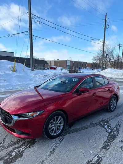 This 2025 Mazda MAZDA3 in stunning red is a sleek and reliable choice for your next ride! With low m...