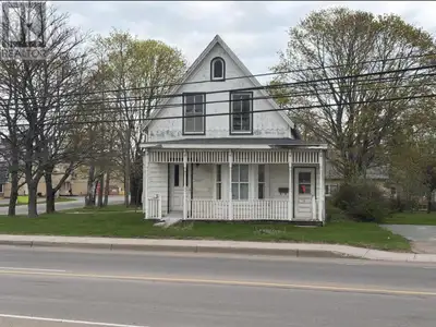 Seize a rare opportunity to own a corner lot in a high-visibility location on Main Street in the hea...