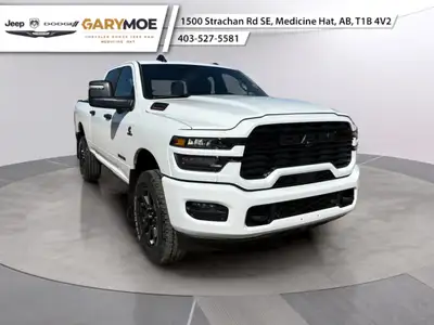 Introducing the 2026 Ram 2500 Big Horn 4x4 Crew Cab with a 64 Box in a vibrant white exterior paired...