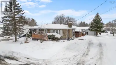 UNIQUE HOME strategically placed on a great lot in Amherst NS, complete with heated indoor/in-ground...
