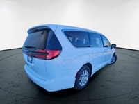 The 2024 Chrysler Pacifica Touring-L FWD, dressed in a pristine white finish, offers a smooth and co... (image 3)