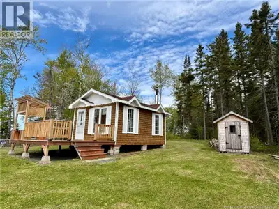 WATERFRONT, OFF GRID & ACREAGE! This waterfront property offers a peaceful and private natural setti...