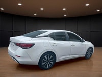 The 2023 Nissan Sentra SV CVT in pristine White is a front-wheel-drive sedan that handles beautifull... (image 4)