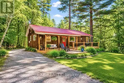 **PRIVATE MADAWASKA RIVER RETREAT - 205 FEET OF WATERFRONT!**Welcome to your own 1.41 acre waterfron...