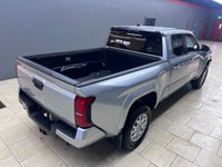 The 2025 Toyota Tacoma SR5, clad in a refined Silver finish, is ready to tackle any terrain with its... (image 8)