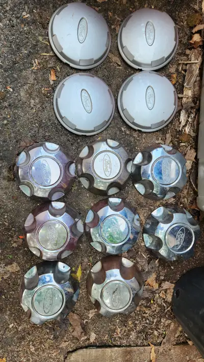 Ford ranger wheels caps x3 set $20. Each and 2007 Ford ranger Generator $50. , starter $50., side ga...