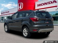 Confident command meets exceptional convenience in this superb gray 2019 Ford Escape SEL sport utili... (image 4)
