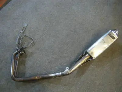 I have a used complete Yoshimura exhaust for a Kawasaki Ninja 300. Head pipe does have a dent in is....