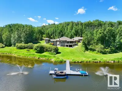 Do you want to own a lake? Well you can, 30 minutes from Edmonton - a sprawling 4,400 sq ft luxury h...