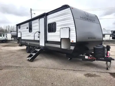 Keystone Hideout travel trailer 262BHS highlights: Front Private Bedroom 20' Power Awning with LED L...