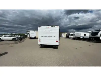 Keystone Springdale Mini travel trailer 1660RB highlights: Full Rear Bath Front Olympic RV Queen Bed...