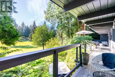 Welcome to 6070 Marine Drive. This mid-century post and beam home has undergone an extensive renovat...