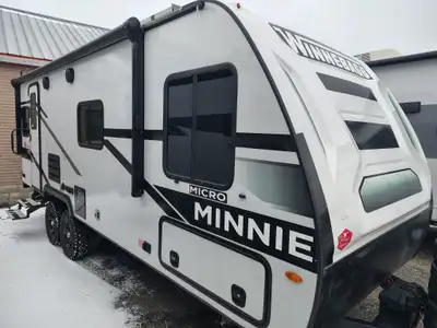 The 2023 Winnebago Micro Minnie 2225RL is a 25-foot, 5-inch lightweight travel trailer that sleeps u...